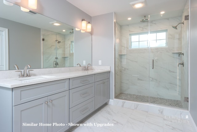 bathroom with tile floors, a shower with door, and dual vanity