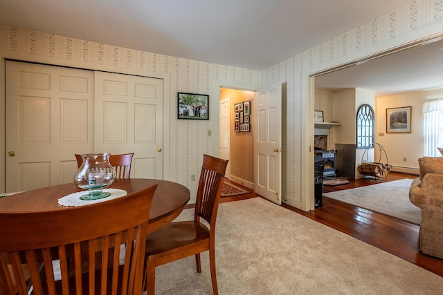 dining space with hardwood / wood-style flooring