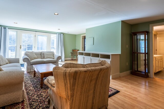 living room with light hardwood / wood-style flooring and baseboard heating