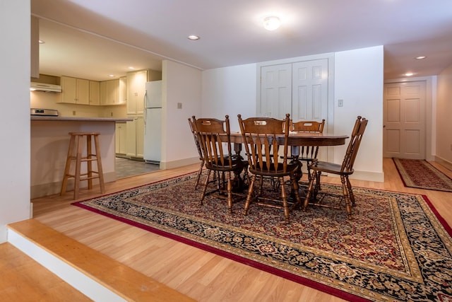 dining space featuring light hardwood / wood-style floors