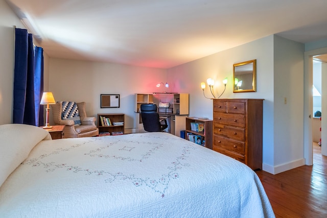 bedroom with wood-type flooring