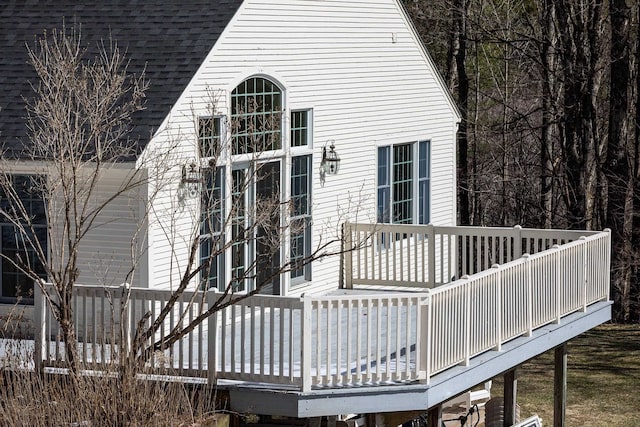 rear view of property with a wooden deck