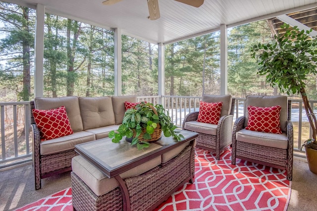 sunroom featuring ceiling fan