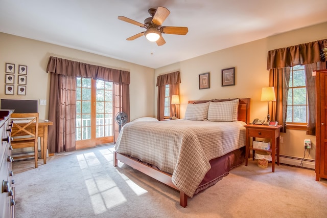 bedroom with light colored carpet, ceiling fan, access to exterior, and multiple windows