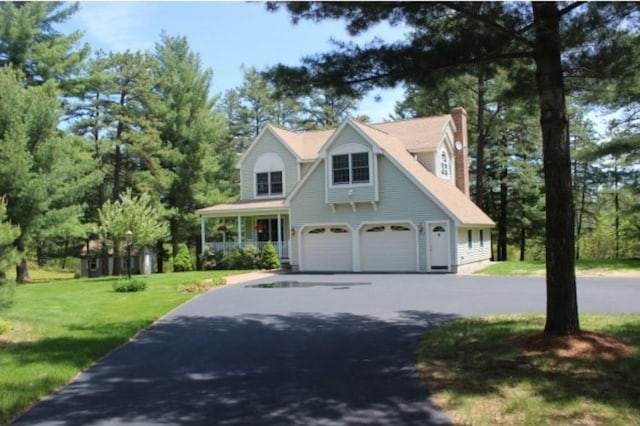 view of front of home with a garage and a front yard