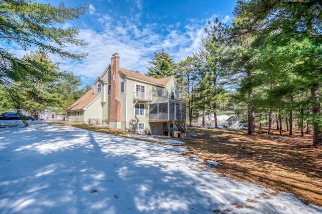 view of front of home with a sunroom