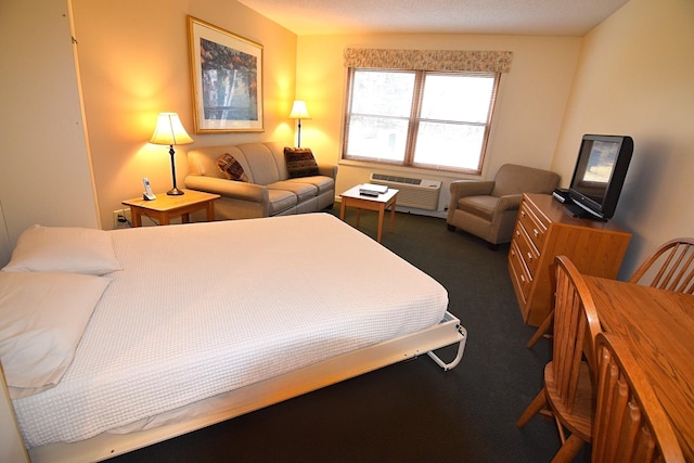 carpeted bedroom featuring a wall mounted air conditioner