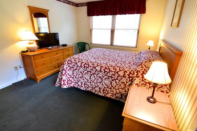 carpeted bedroom featuring multiple windows