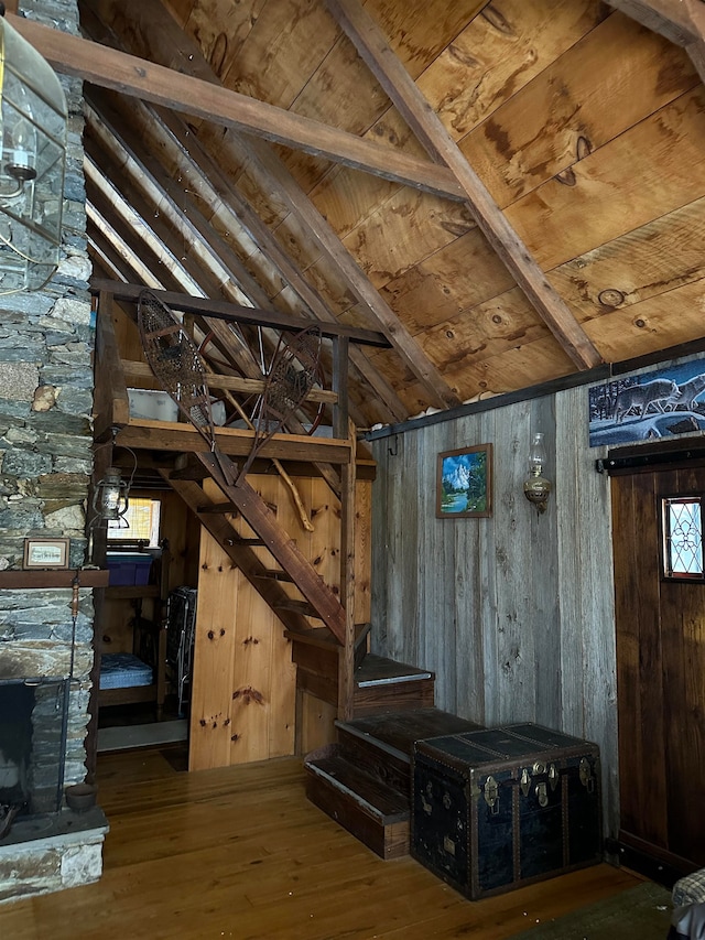 basement with wood ceiling, wood walls, and wood-type flooring