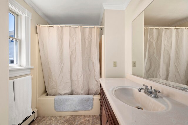 bathroom with a baseboard radiator, large vanity, tile floors, and crown molding
