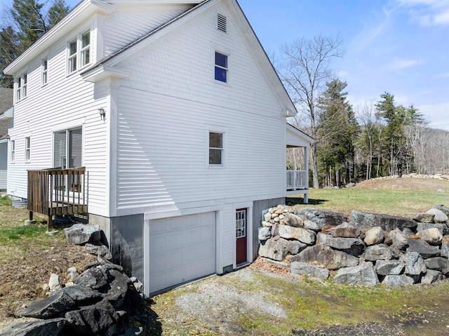 view of property exterior with a garage