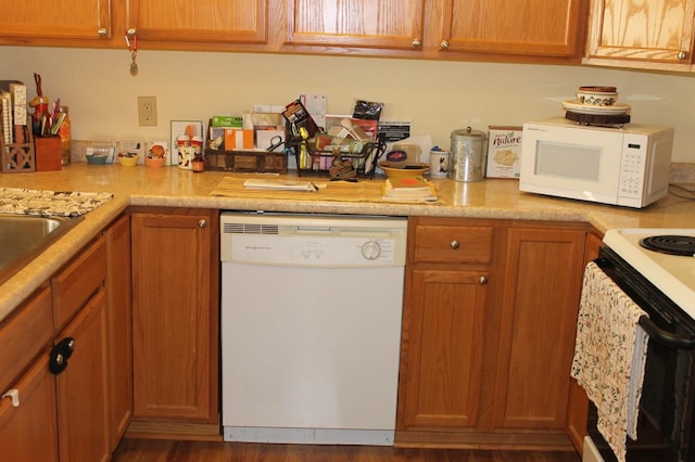 kitchen with wood-type flooring and white appliances