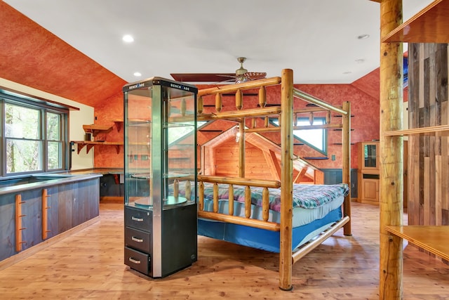 bedroom with vaulted ceiling and light hardwood / wood-style floors