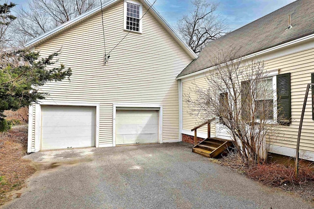 view of side of property featuring a garage