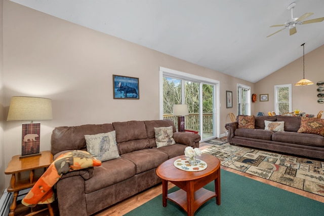 living room featuring hardwood / wood-style floors, high vaulted ceiling, and ceiling fan