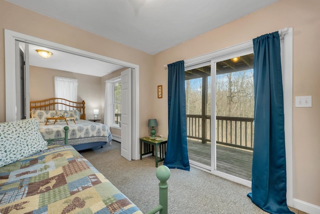 bedroom featuring carpet, access to outside, and baseboard heating