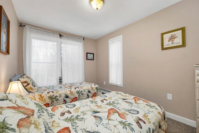 bedroom featuring a baseboard radiator and carpet