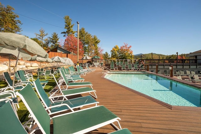 view of swimming pool with a wooden deck