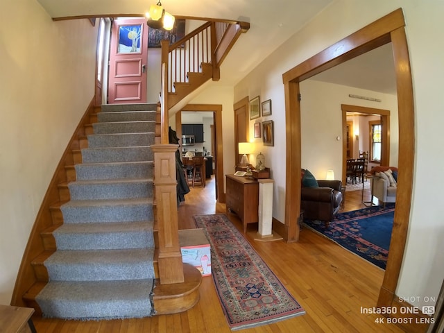 staircase with wood-type flooring