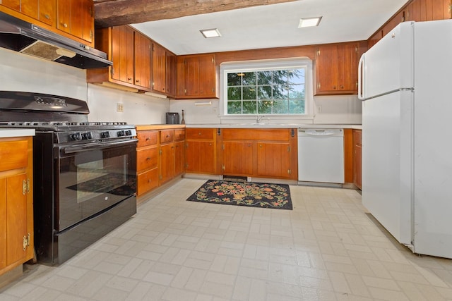 kitchen featuring beamed ceiling, sink, white appliances, and light tile floors