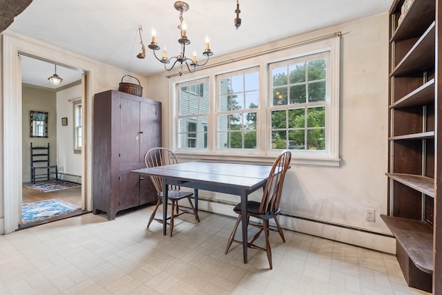 dining area featuring baseboard heating, an inviting chandelier, light tile floors, and ornamental molding