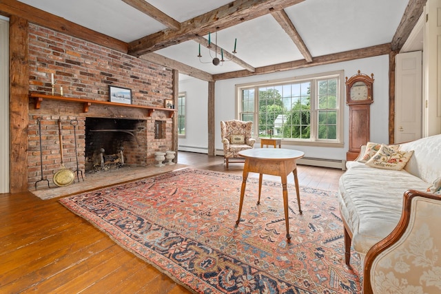 living room with hardwood / wood-style flooring, beam ceiling, and a brick fireplace