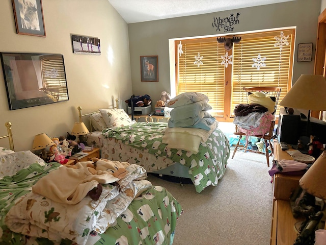 carpeted bedroom with lofted ceiling