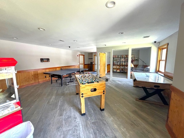 game room with dark wood-type flooring