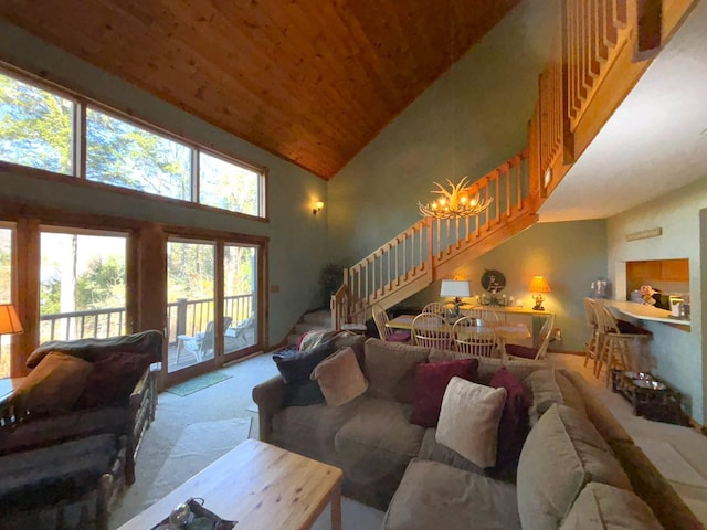 carpeted living room featuring wood ceiling, high vaulted ceiling, and a notable chandelier