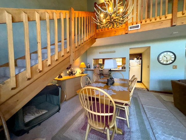 dining area with an inviting chandelier