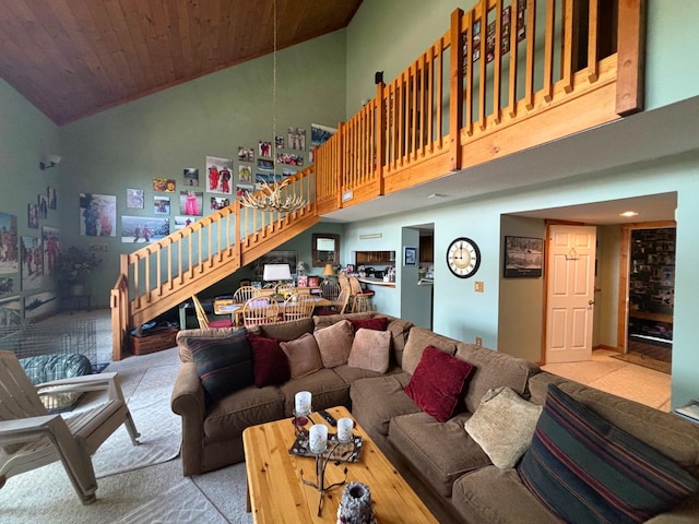 carpeted living room featuring wood ceiling and high vaulted ceiling