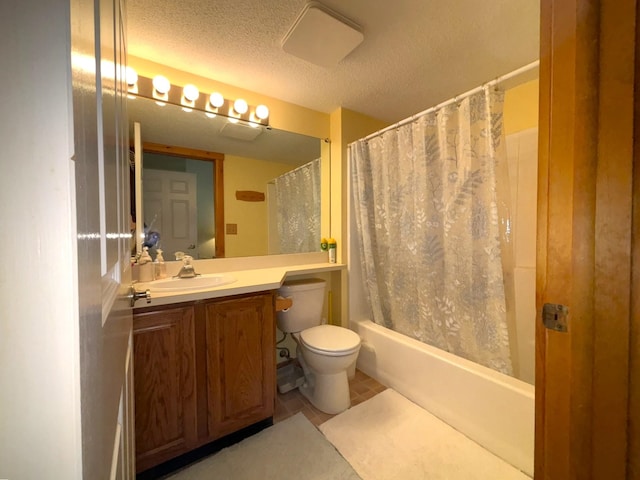 full bathroom featuring a textured ceiling, toilet, vanity, shower / tub combo with curtain, and tile patterned flooring