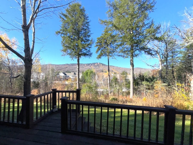 wooden deck with a mountain view