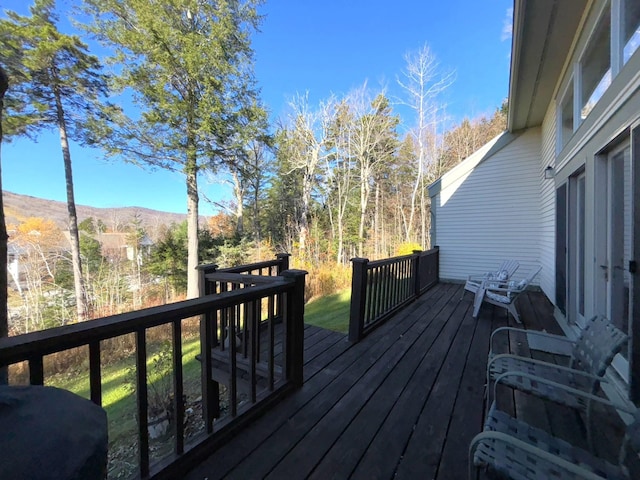 wooden terrace with a mountain view