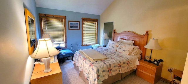 carpeted bedroom featuring lofted ceiling