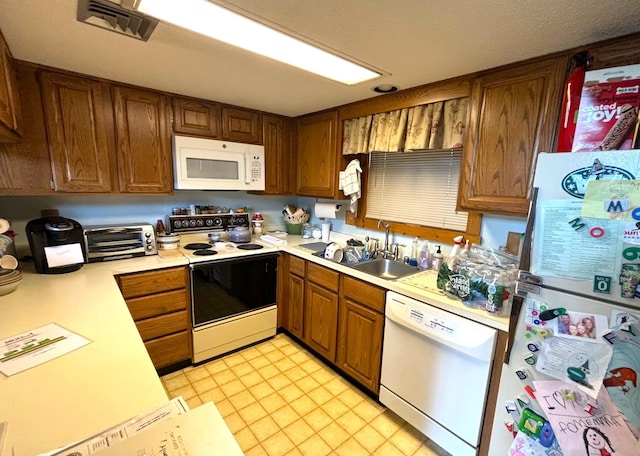 kitchen with sink and white appliances