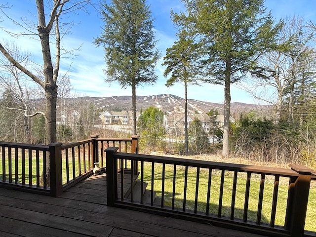 wooden deck featuring a mountain view