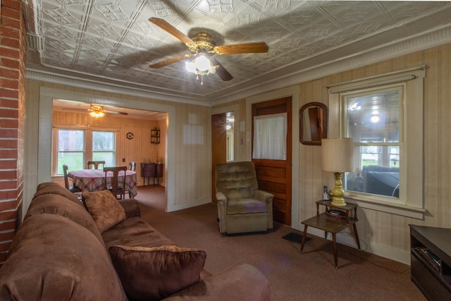 living room featuring ceiling fan and carpet flooring