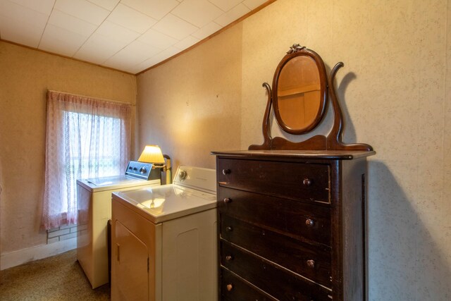 interior space featuring crown molding and washer and clothes dryer