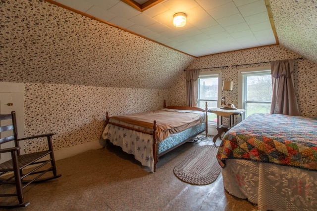 bedroom with lofted ceiling and carpet floors