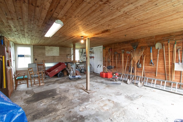 miscellaneous room featuring wooden ceiling and concrete floors