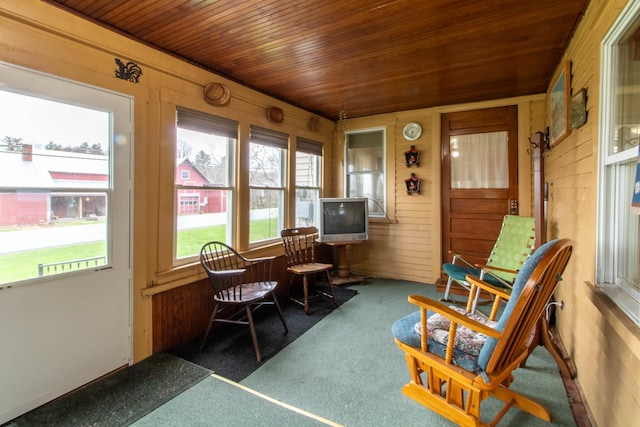 sunroom featuring wooden ceiling