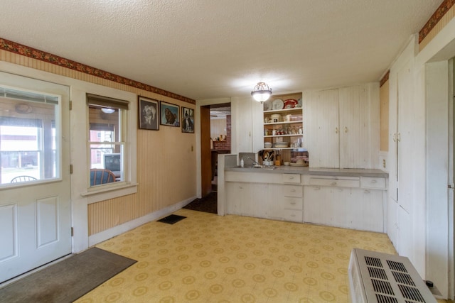 kitchen featuring sink and a textured ceiling