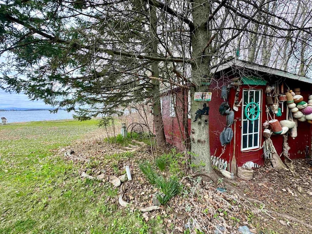 view of shed / structure featuring a water view