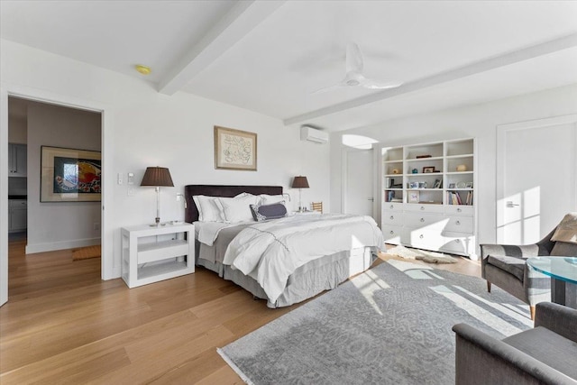 bedroom with baseboards, beamed ceiling, a wall mounted AC, and wood finished floors