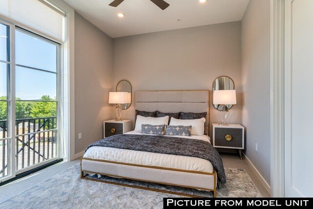 carpeted bedroom featuring access to outside, ceiling fan, and multiple windows