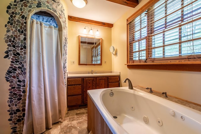 bathroom with beam ceiling, tile floors, and vanity