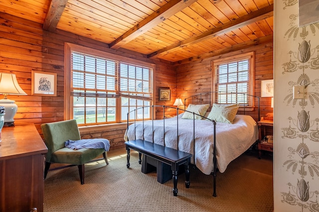 carpeted bedroom with wooden ceiling and beam ceiling