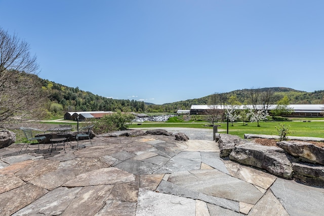 view of patio / terrace featuring a mountain view