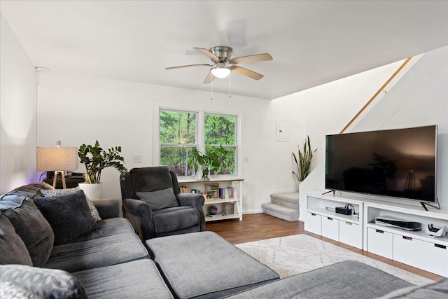 living room with hardwood / wood-style flooring and ceiling fan